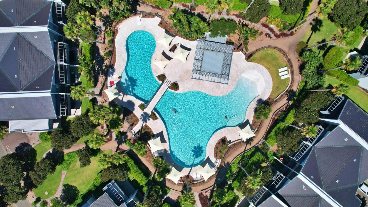 プルマン　マジェンタ　ショアーズ　リゾート ジ・エントランス エクステリア 写真 Aerial view of the pool at the 2018 Commonwealth Games